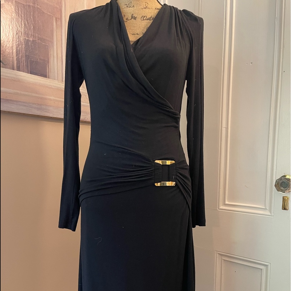 Black cotton long sleeve cocktail dress with low decolte’